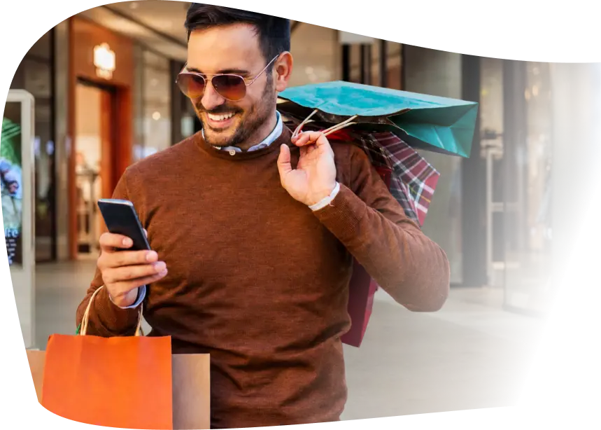 Man using a fintech rewards app while shopping