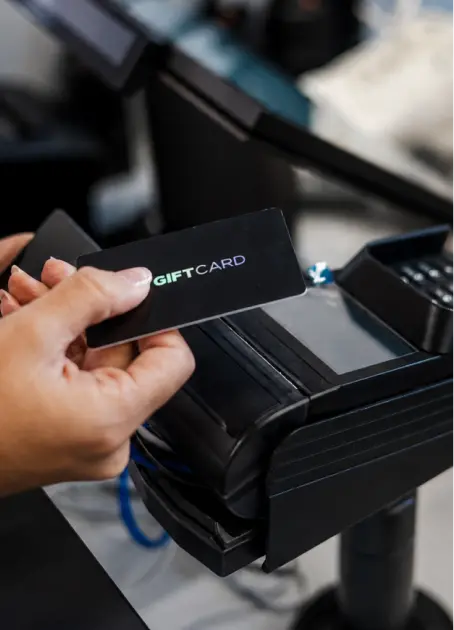 Gift card being presented at a payment terminal